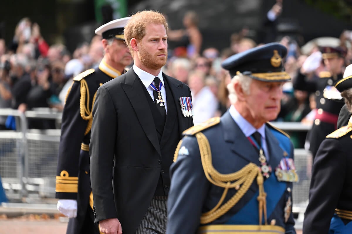 Prince Harry stands behind King Charles III at Queen Elizabeth II's funeral