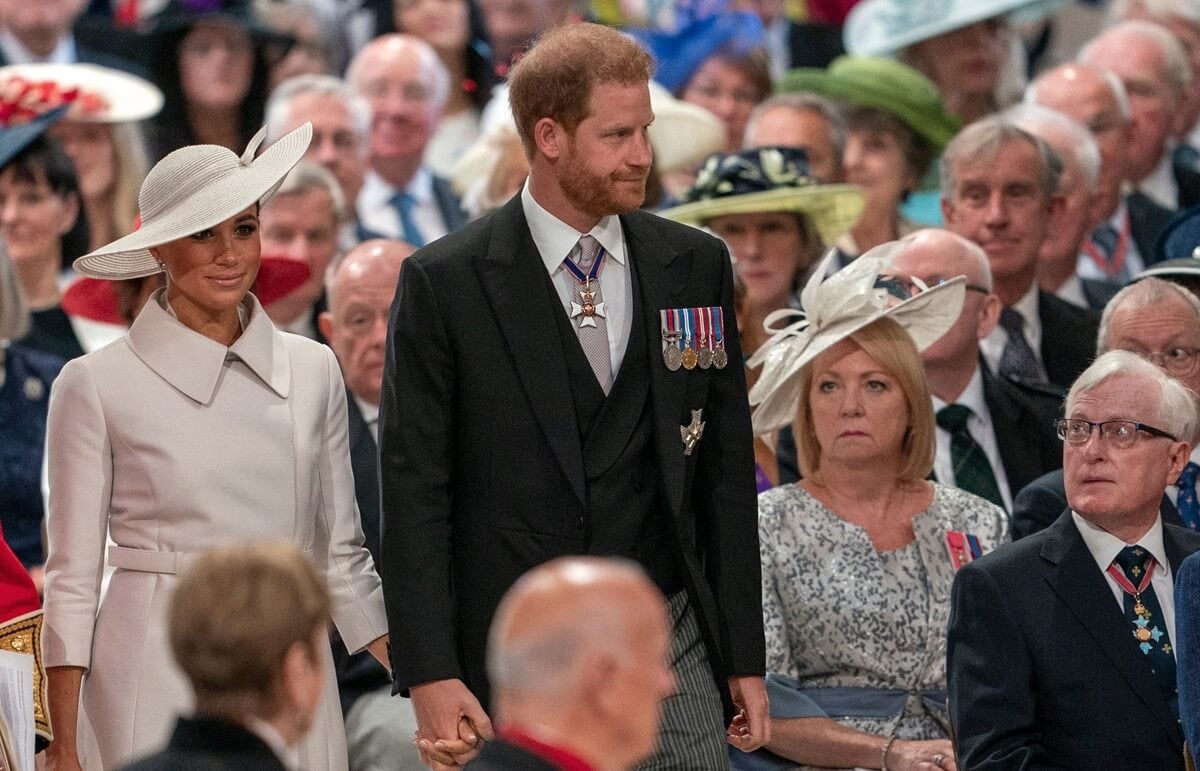 Prince Harry with Meghan Markle, who an expert claims will never be welcomed back in the royal family, arriving for the service of thanksgiving for Queen Elizabeth II