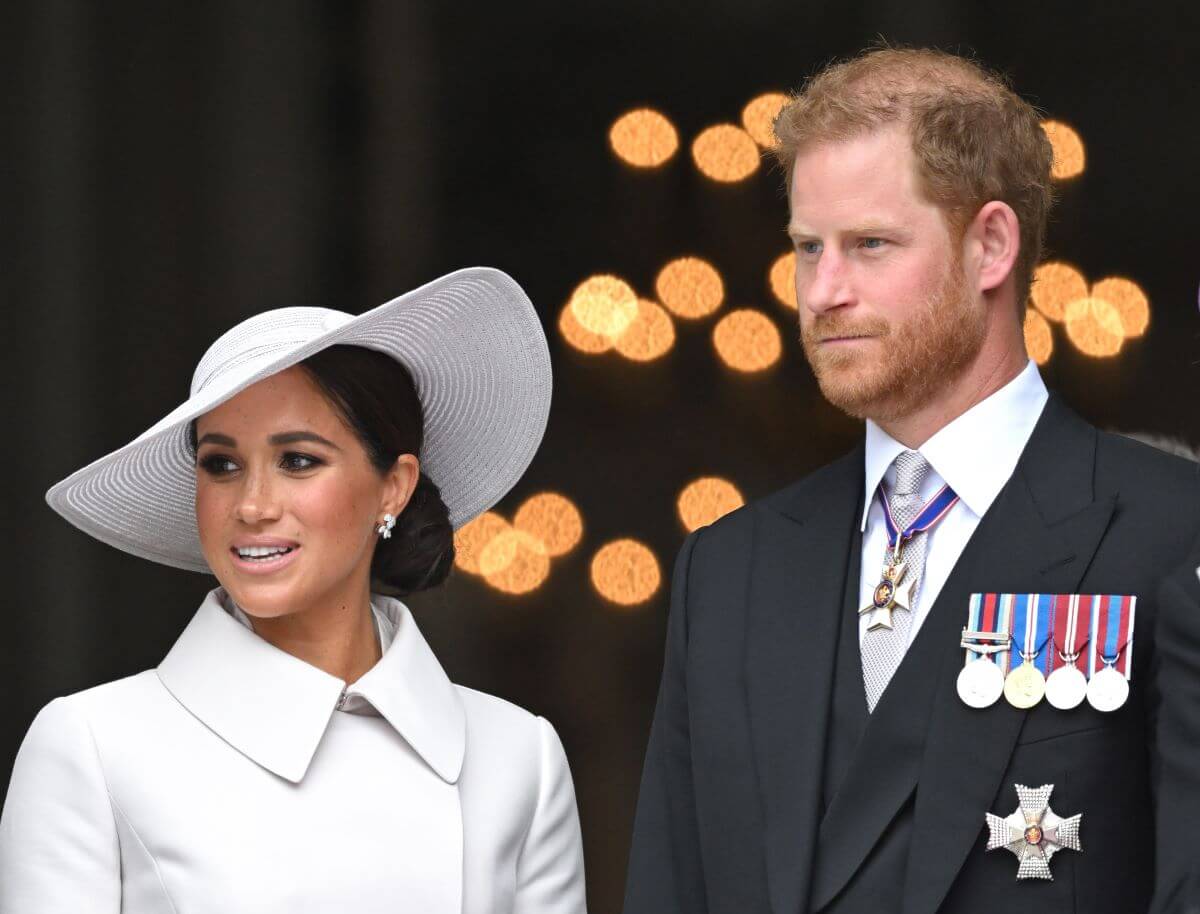 Prince Harry with Meghan Markle, who an expert claims will never be welcomed back in the royal family, attend the National Service of Thanksgiving during Queen Elizabeth II's Platinum Jubilee