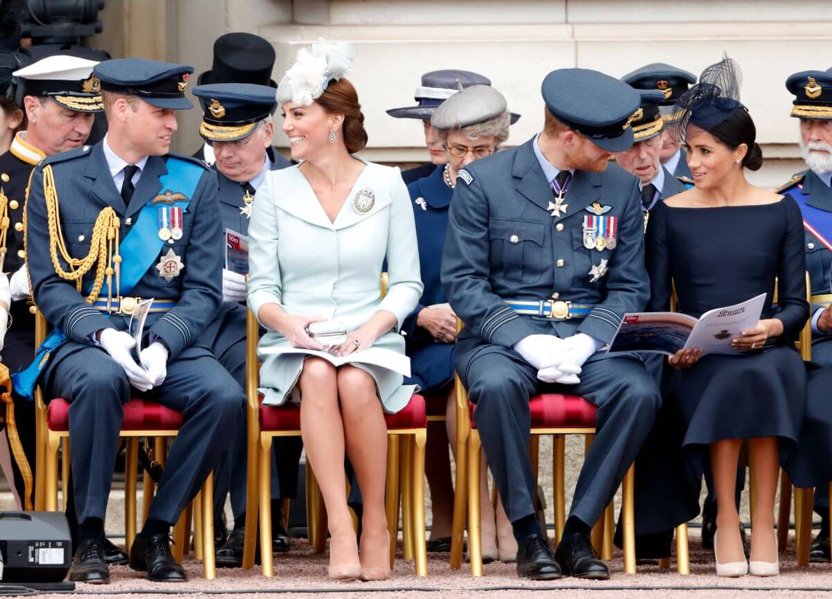 Prince William, Kate Middleton, Prince Harry, and Meghan Markle attend a ceremony to mark the centenary of the Royal Air Force at Buckingham Palace