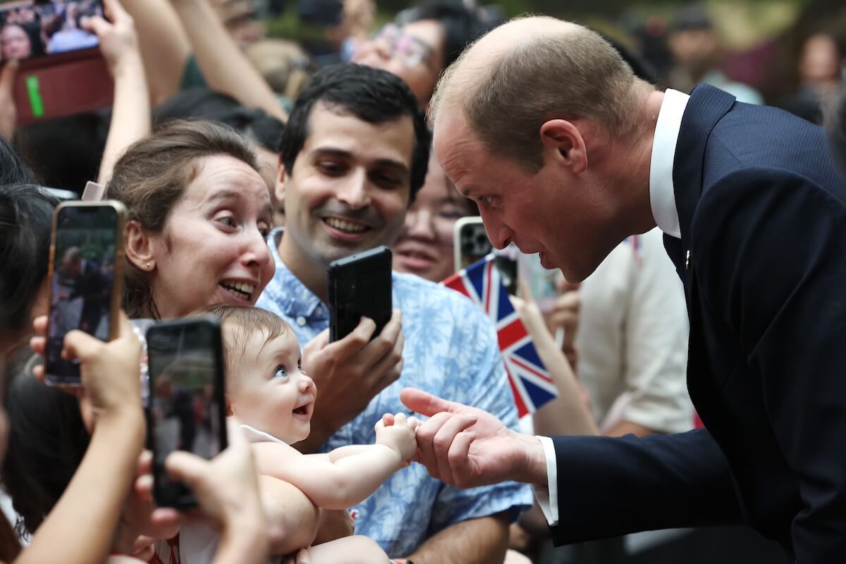 Prince William with a baby in Singapore in 2023