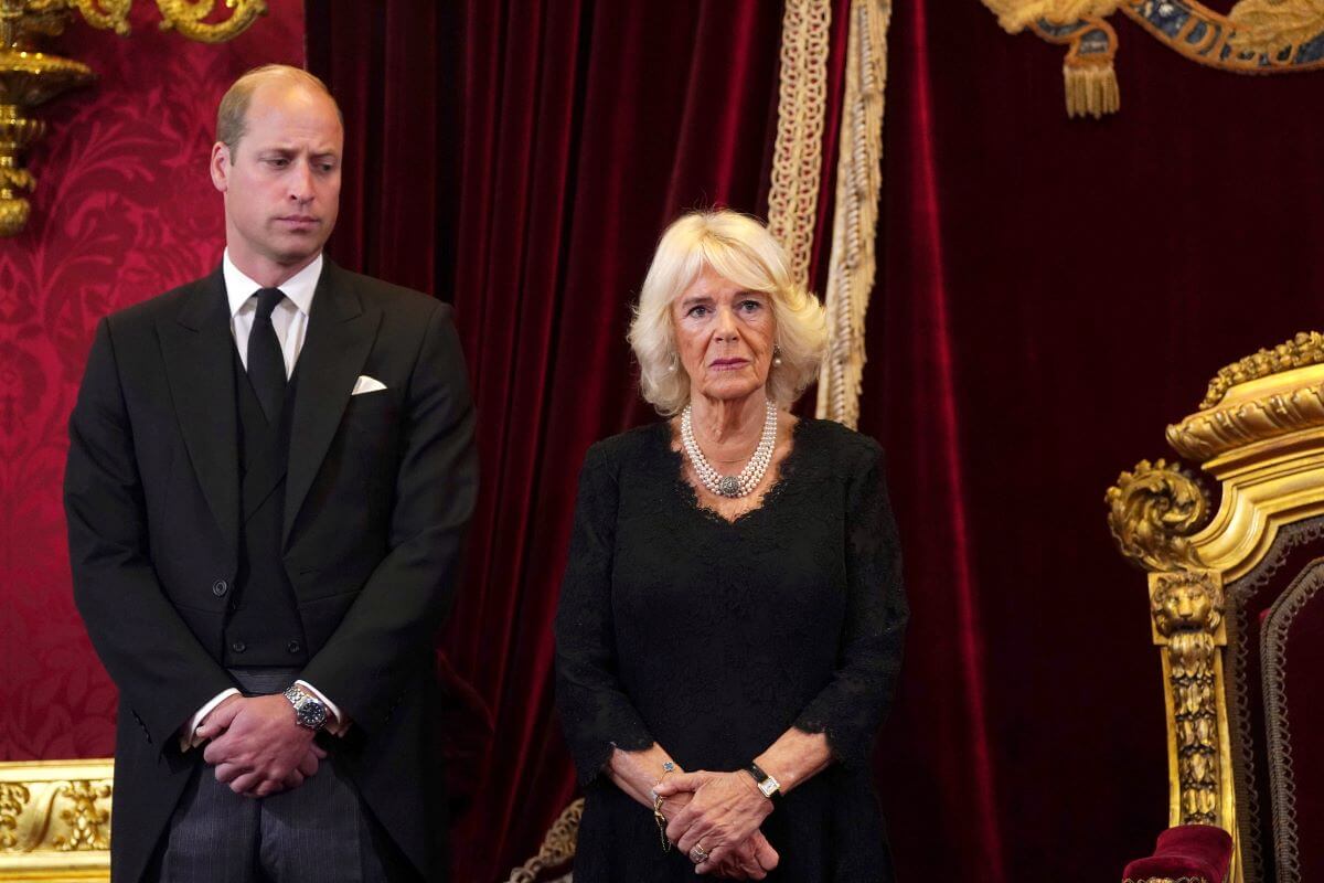 Prince William, whose gesture toward Camilla Parker Bowles (now-Queen Camilla) in a video when she was unsteady on her feet goes viral, look on as King Charles III attends his proclamation during the accession council