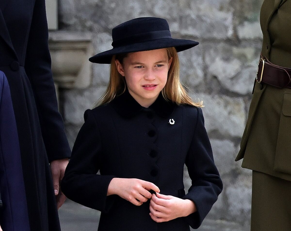 Princess Charlotte who displayed a startled reaction when she notices Prince George isn't next to her as they attend at Queen Elizabeth II's funeral