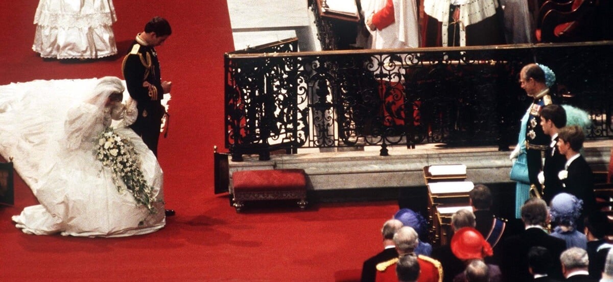 Princess Diana curtsies to Queen Elizabeth II during her wedding ceremony at St. Paul's Cathedral