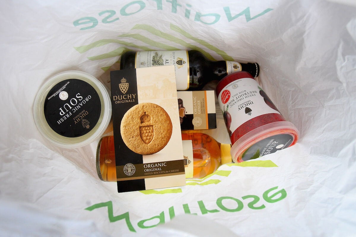 Products from King Charles III's Duchy Originals food brand, as seen in a Waitrose bag