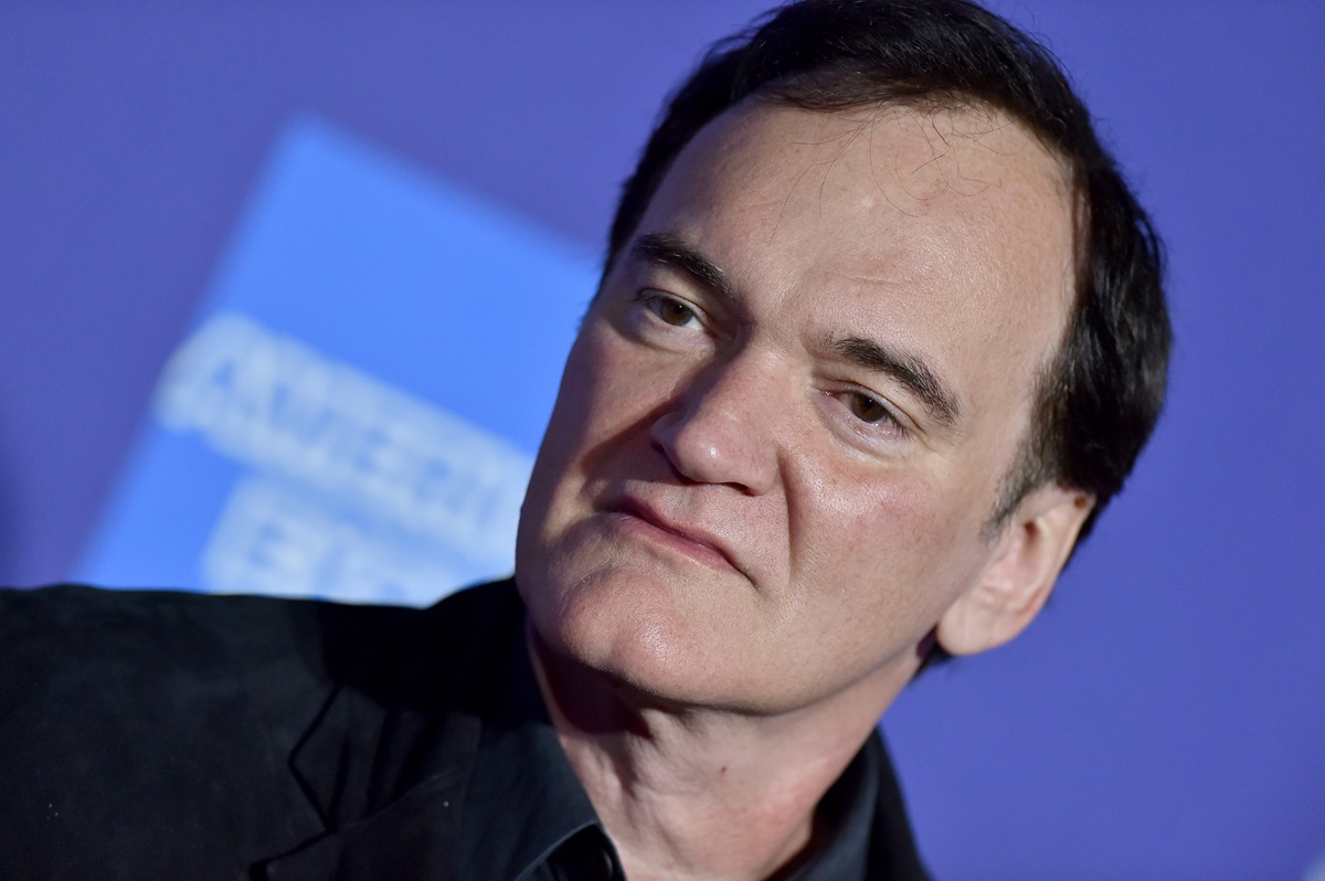 Quentin Tarantino posing in a suit at the 2020 Annual Palm Springs International Film Festival.