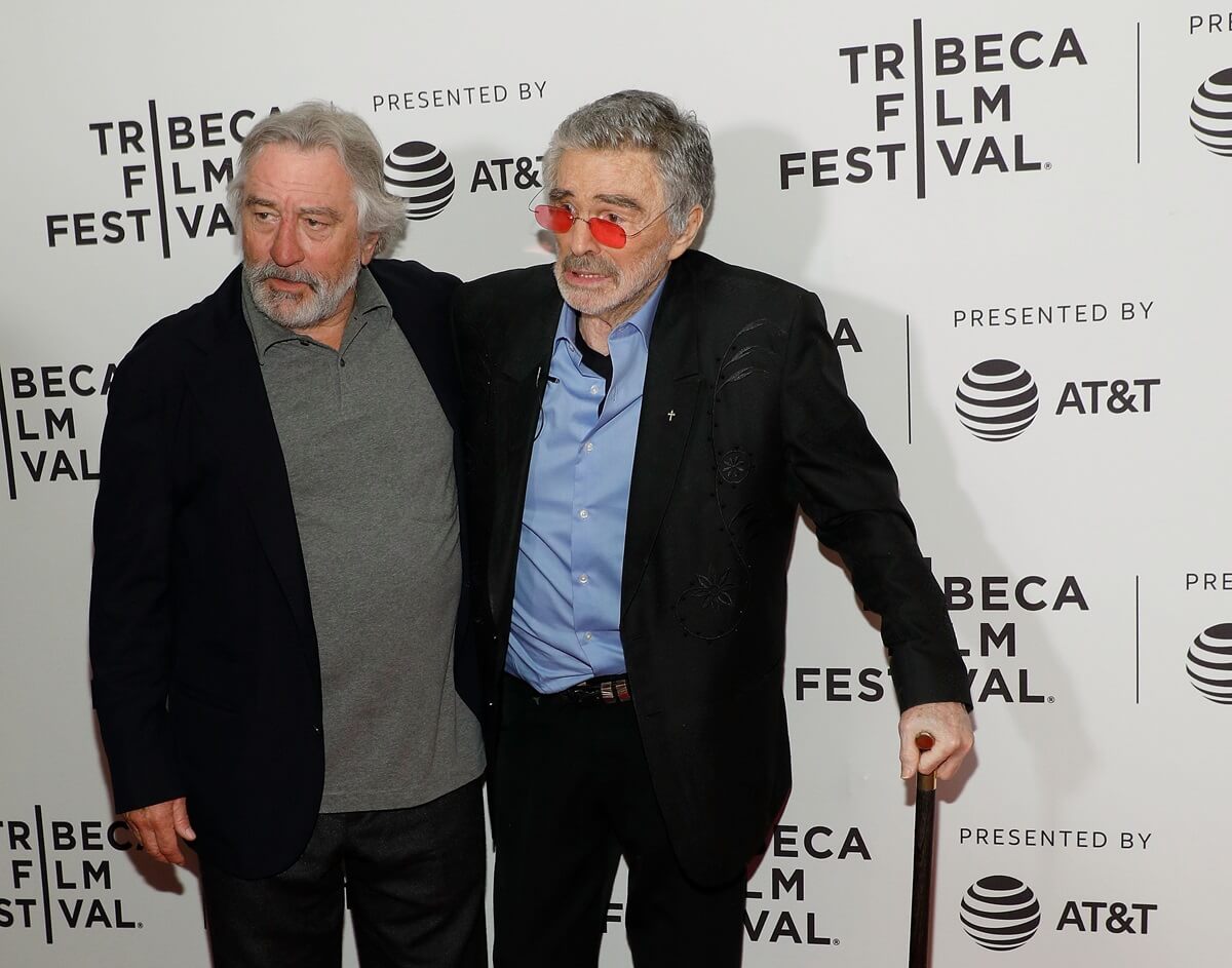 Burt Reynolds posing next to Robert De Niro at the premiere of "Dog Years" during the 2017 Tribeca Film Festival.