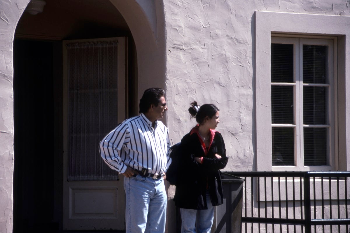 Robert Kardashian and his daughter Kim Kardashian stand outside of her private high school, Marymount High School in Los Angeles, 1996