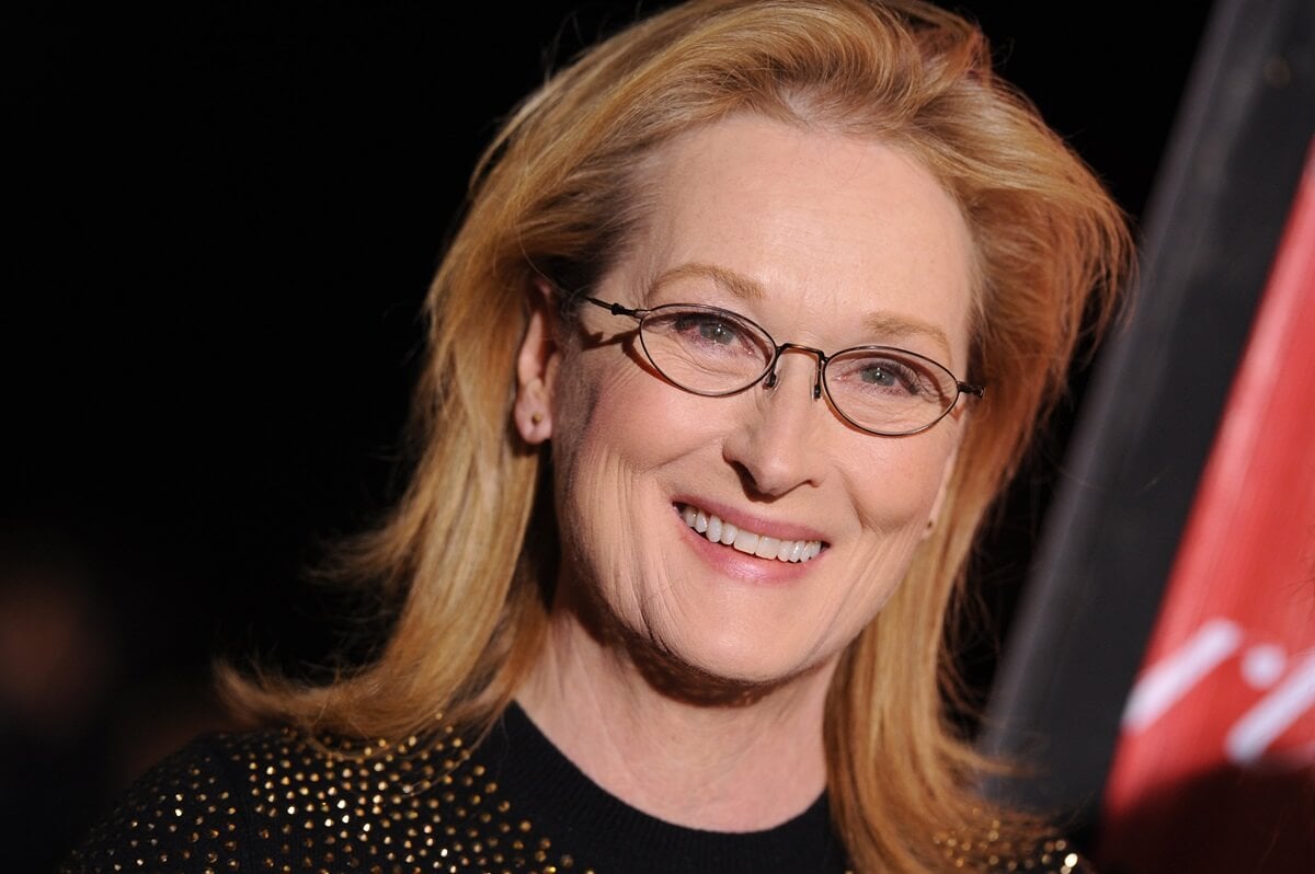 Meryl Streep smiling at the 25th Annual Palm Springs International Film Festival Awards Gala while wearing a black shirt.