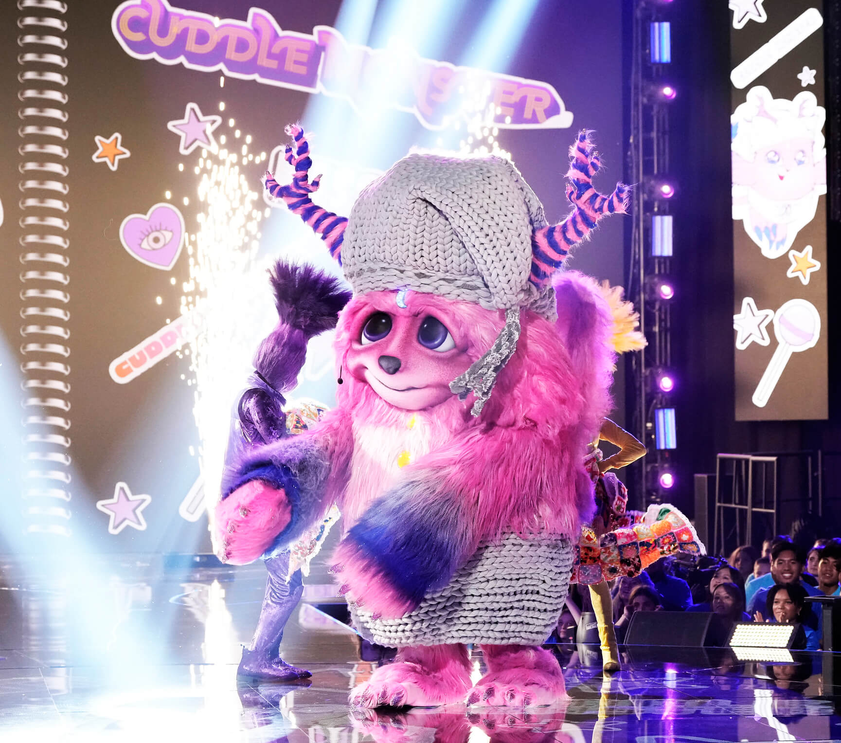 Cuddle Monster in 'The Masked Singer' Season 10 on stage with the crowd behind him