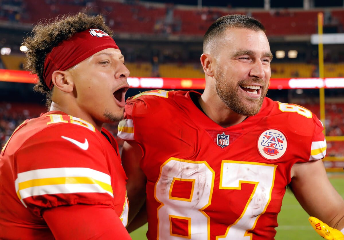 Patrick Mahomes #15 and Travis Kelce #87 of the Kansas City Chiefs celebrate after the Chiefs defeated the Las Vegas Raiders 30-29 to win the game at Arrowhead Stadium on October 10, 2022 in Kansas City, Missouri