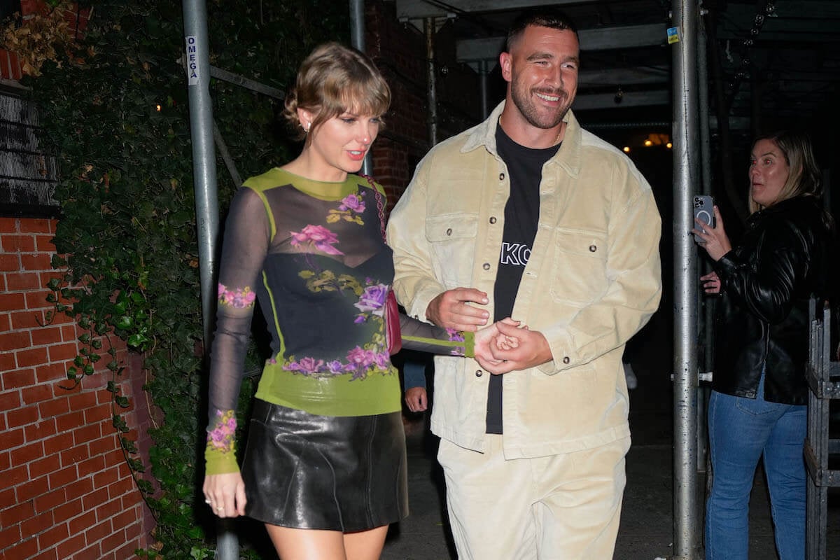 Travis Kelce, who watched Taylor Swift's Argentina Eras show with Scott Swift, walks with Taylor Swift