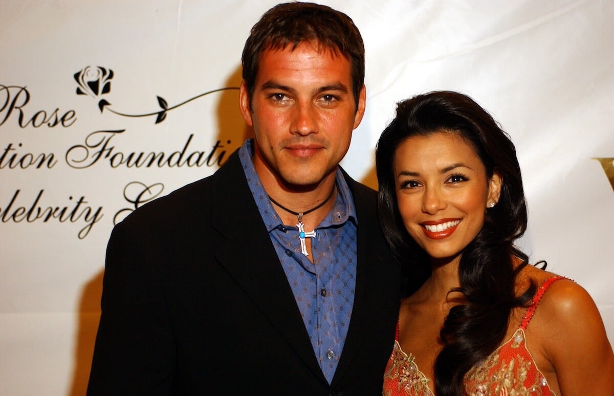 Tyler Christopher and Eva Longoria pose for a photo at an event in 2003