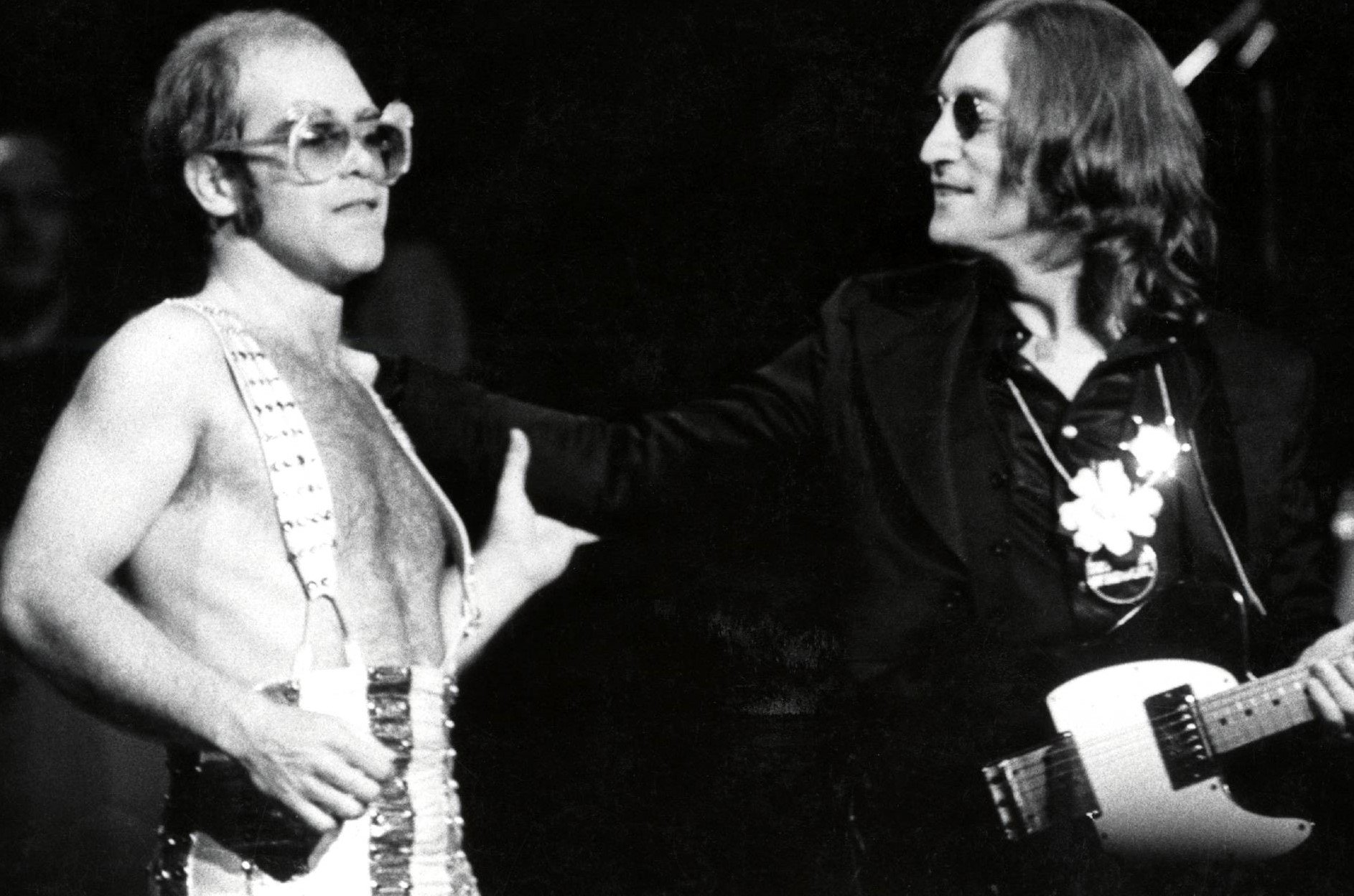 Elton John and John Lennon in black-and-white