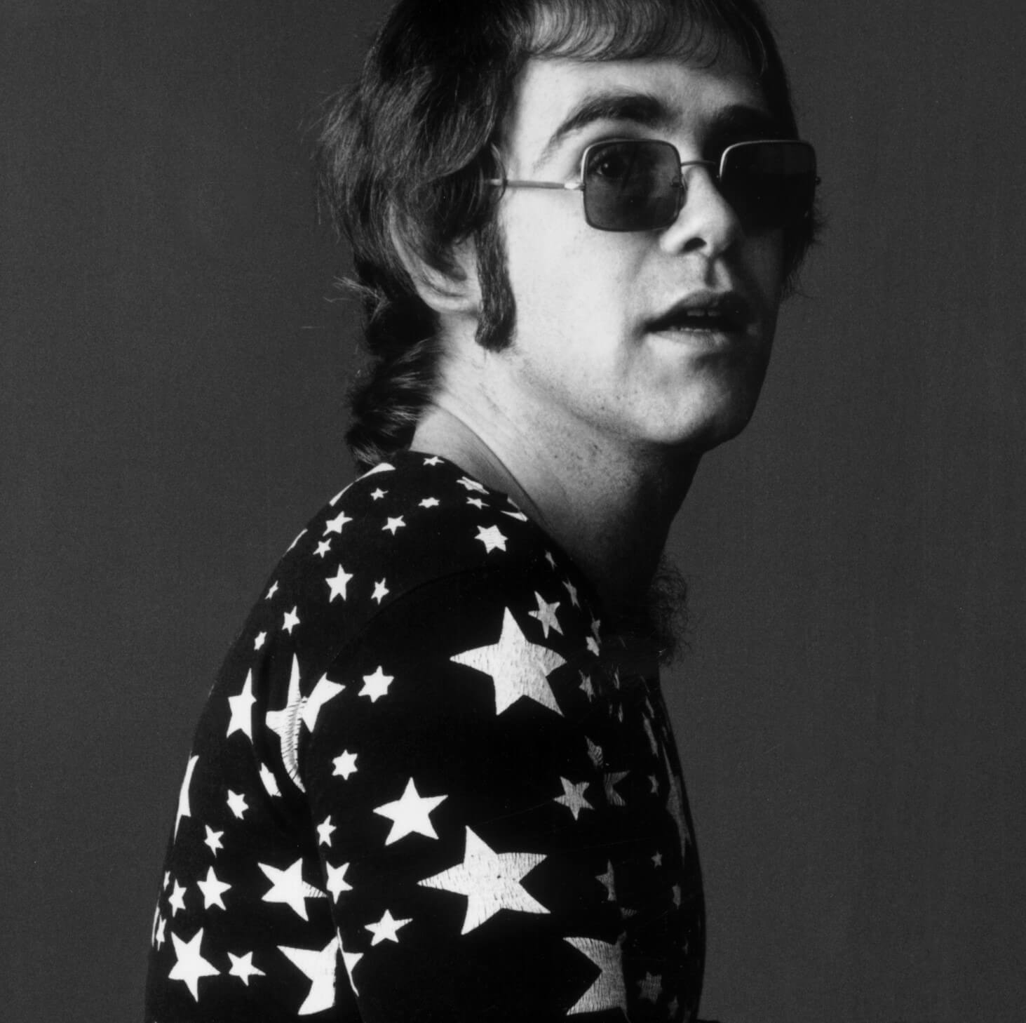 "Lucy in the Sky with Diamonds" singer Elton John wearing a starry shirt