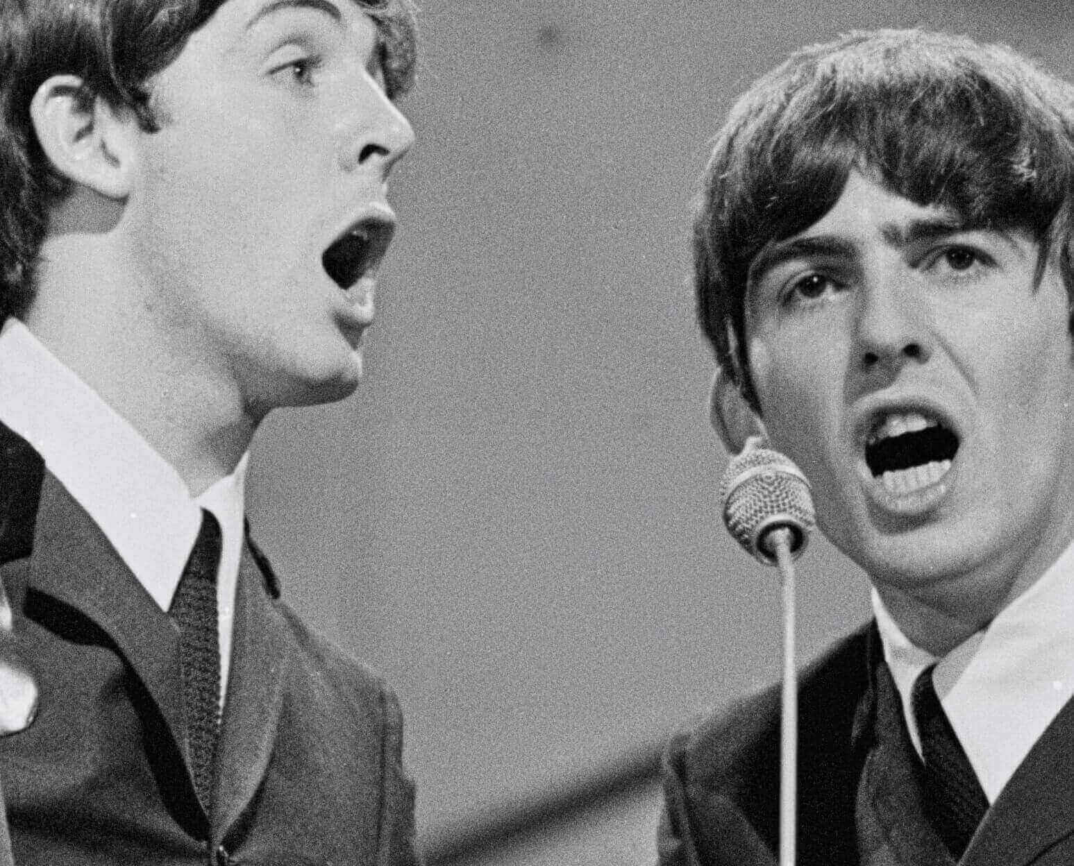 George Harrison and Paul McCartney in black-and-white