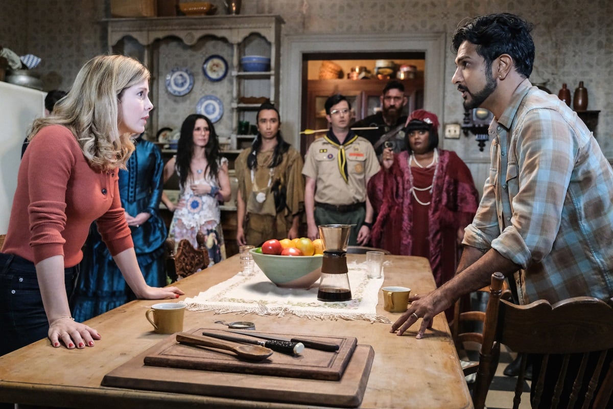 Sam and Jay, along with the spirits stand in the kitchen during a scene in 'Ghosts' season 2, the series will return for its third season in Feb.