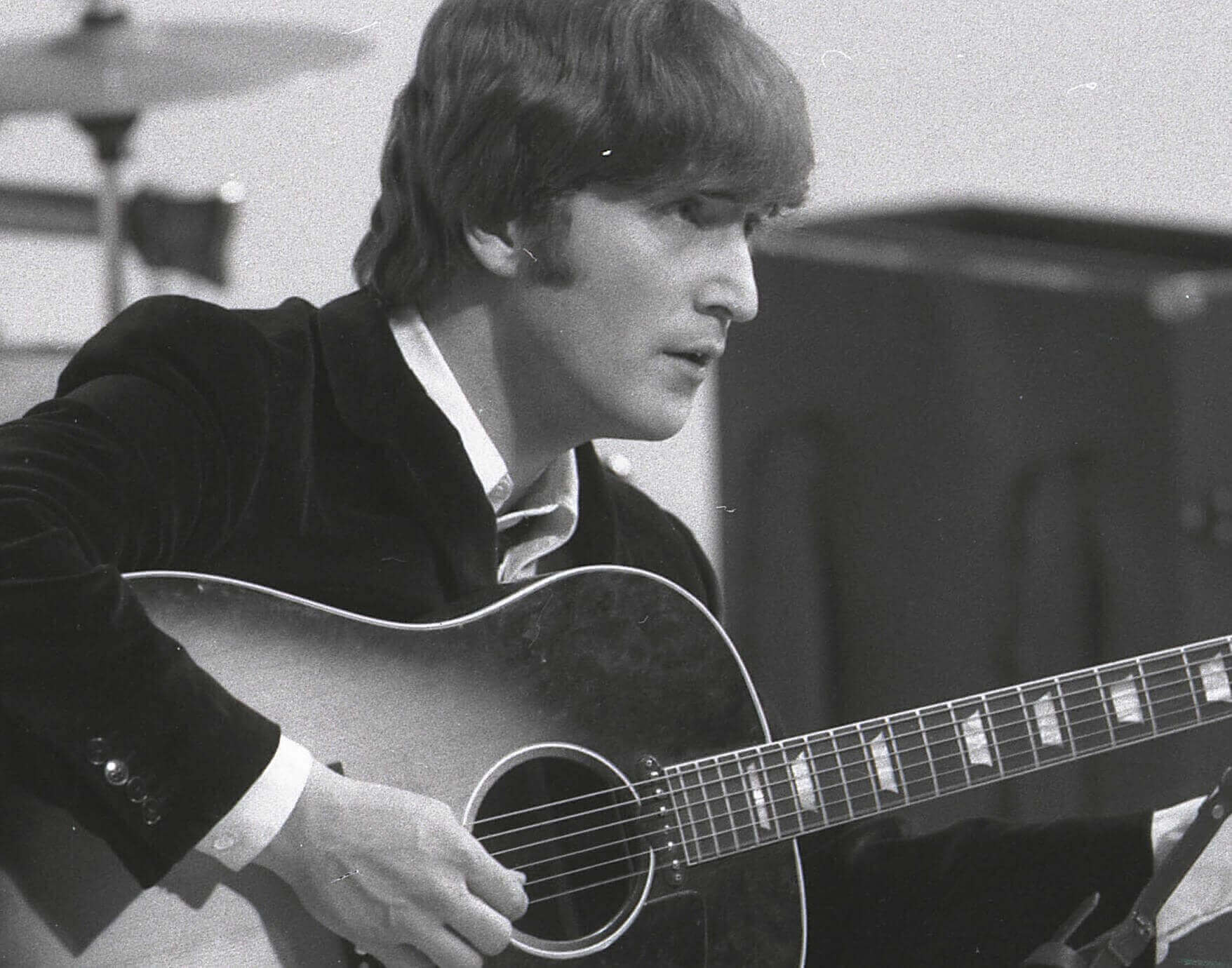 "Mind Games" singer John Lennon with a guitar