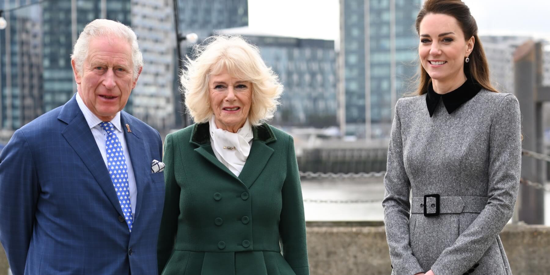 King Charles and Camilla Parker Bowles pose with Kate Middleton at Trinity Buoy Wharf on February 03, 2022.