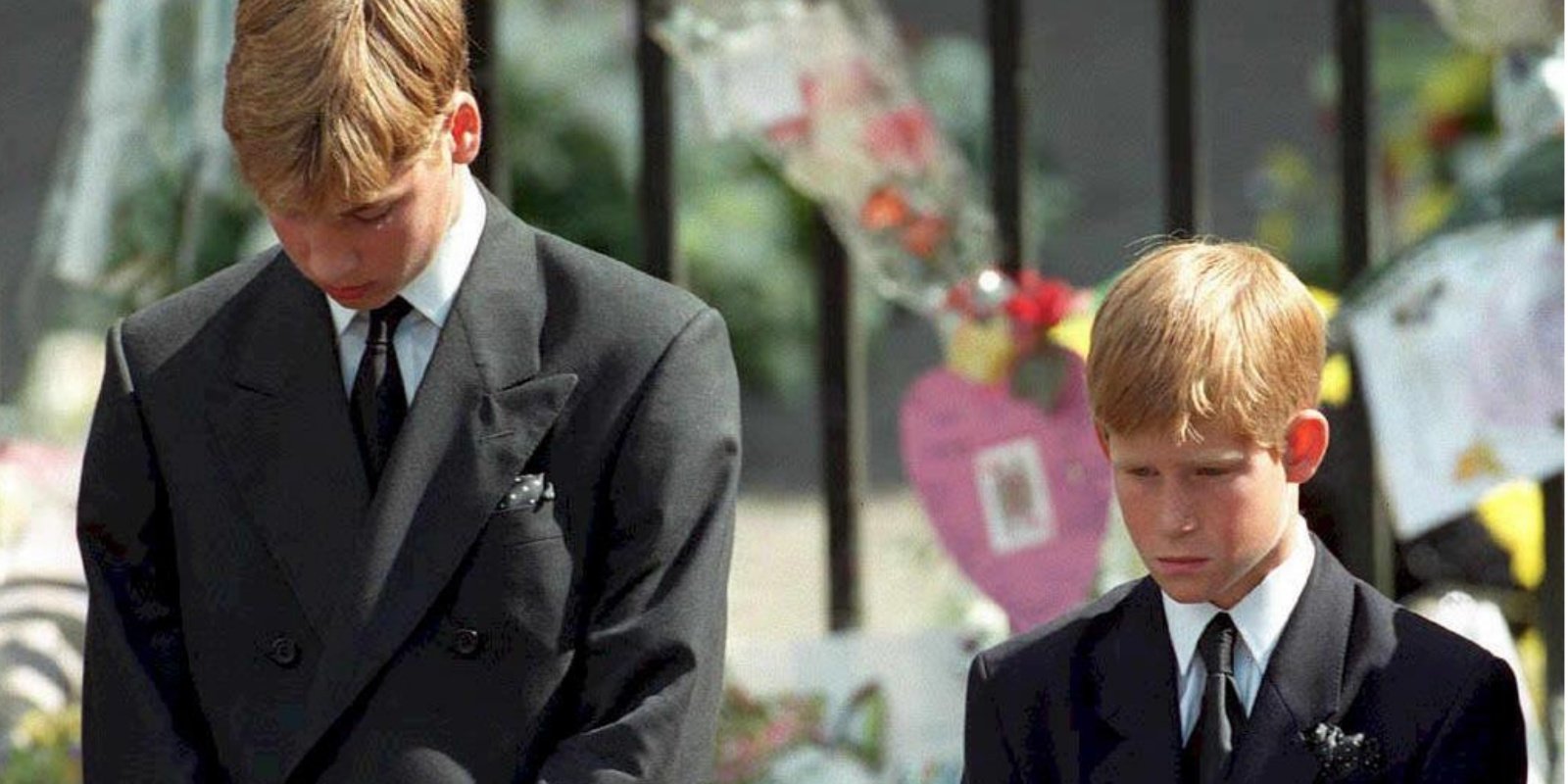 Prince William and Prince Harry walk behind Princess Diana's casket during her funeral procession.