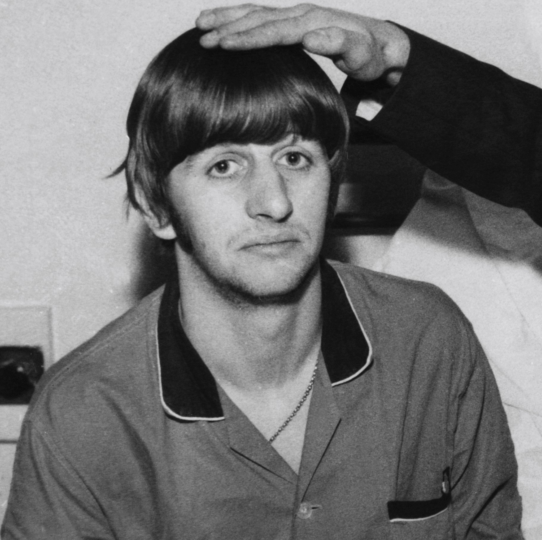 "Back Off Boogaloo" singer Ringo Starr getting a pat on the head