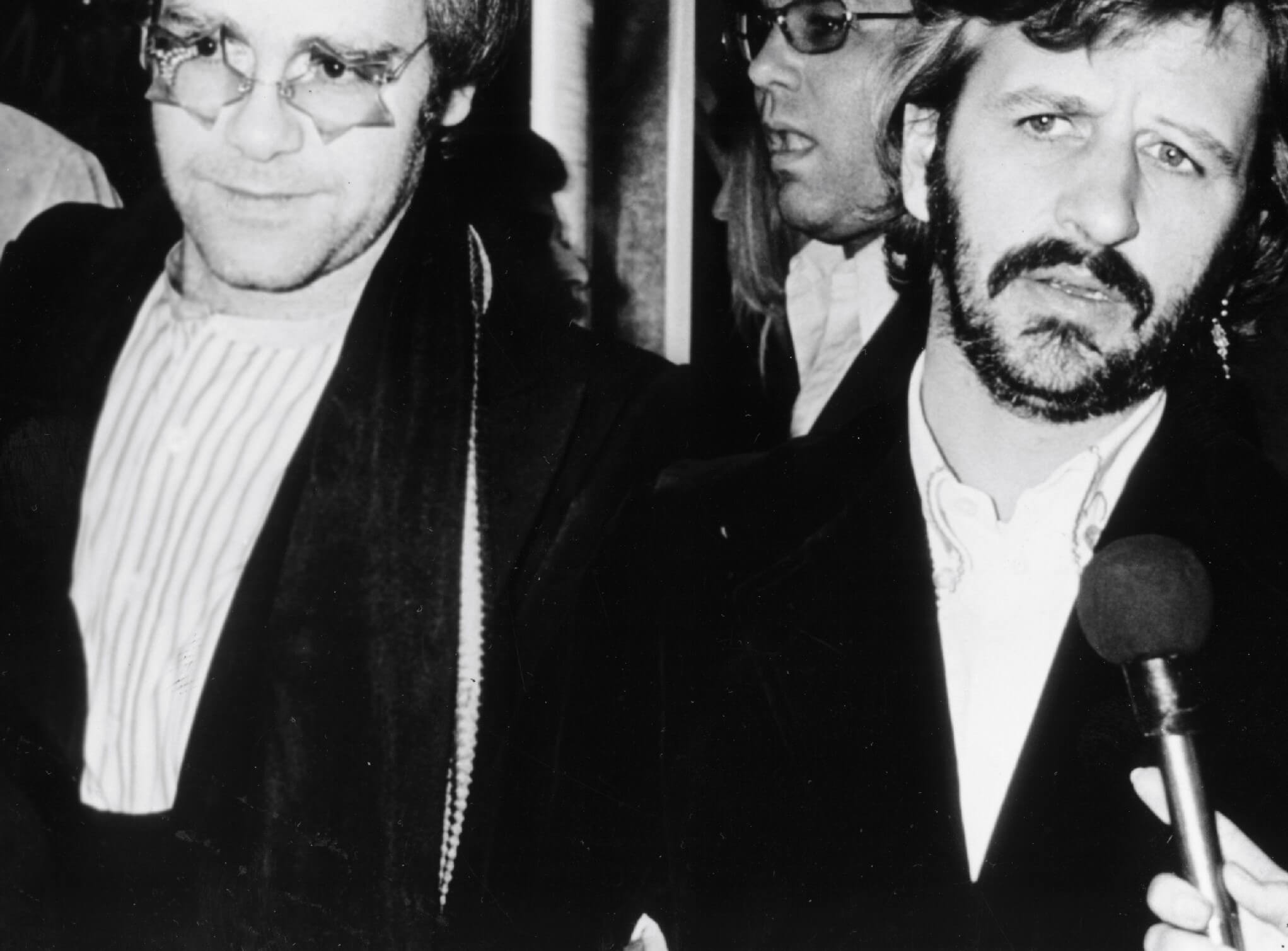 Elton John and Ringo Starr wearing suits