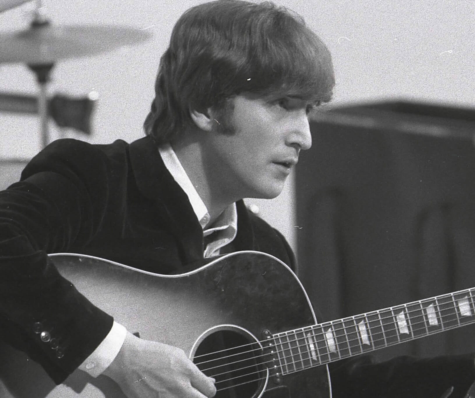 The Beatles' John Lennon wearing a suit