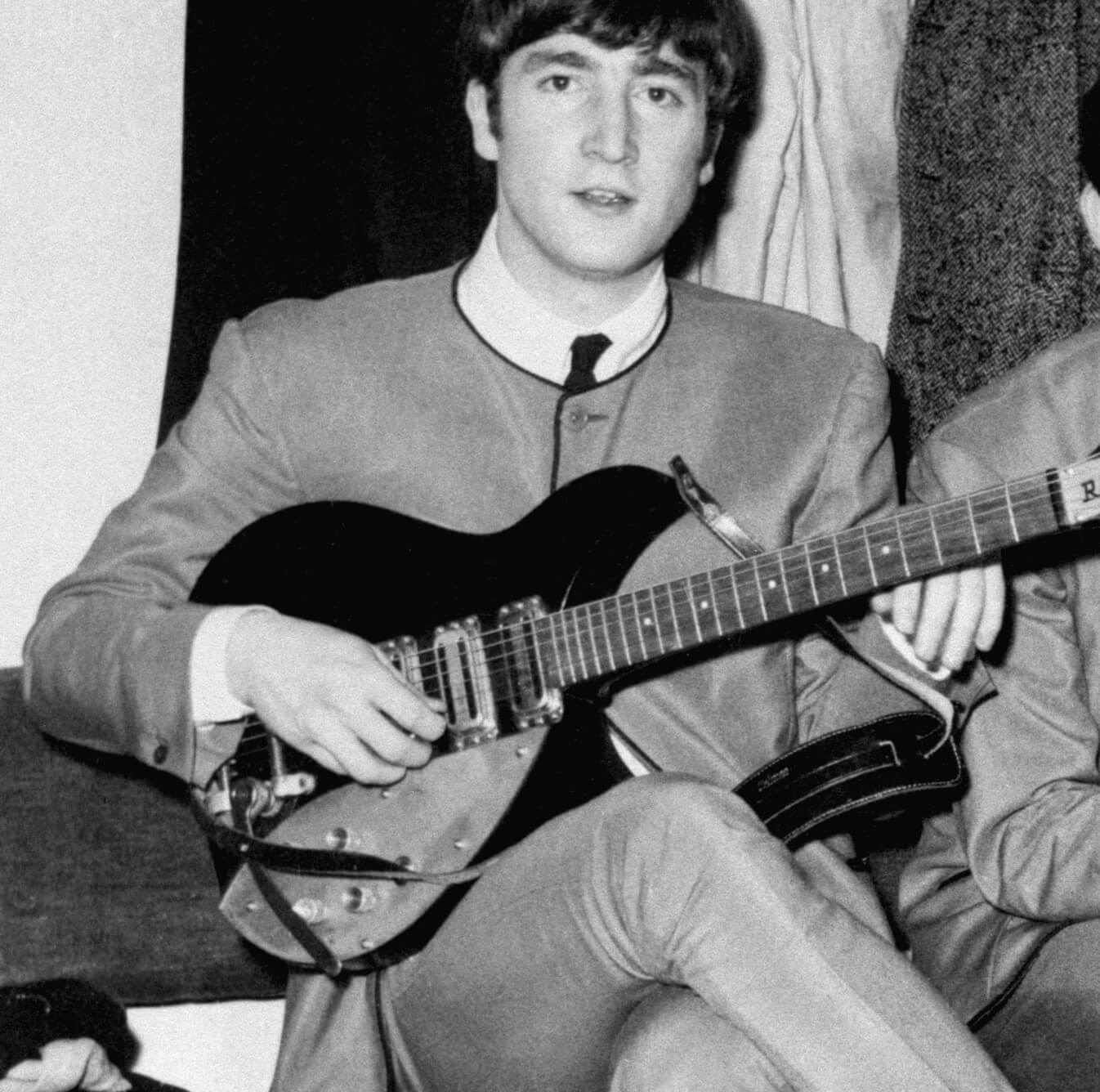 The Beatles' John Lennon with a guitar