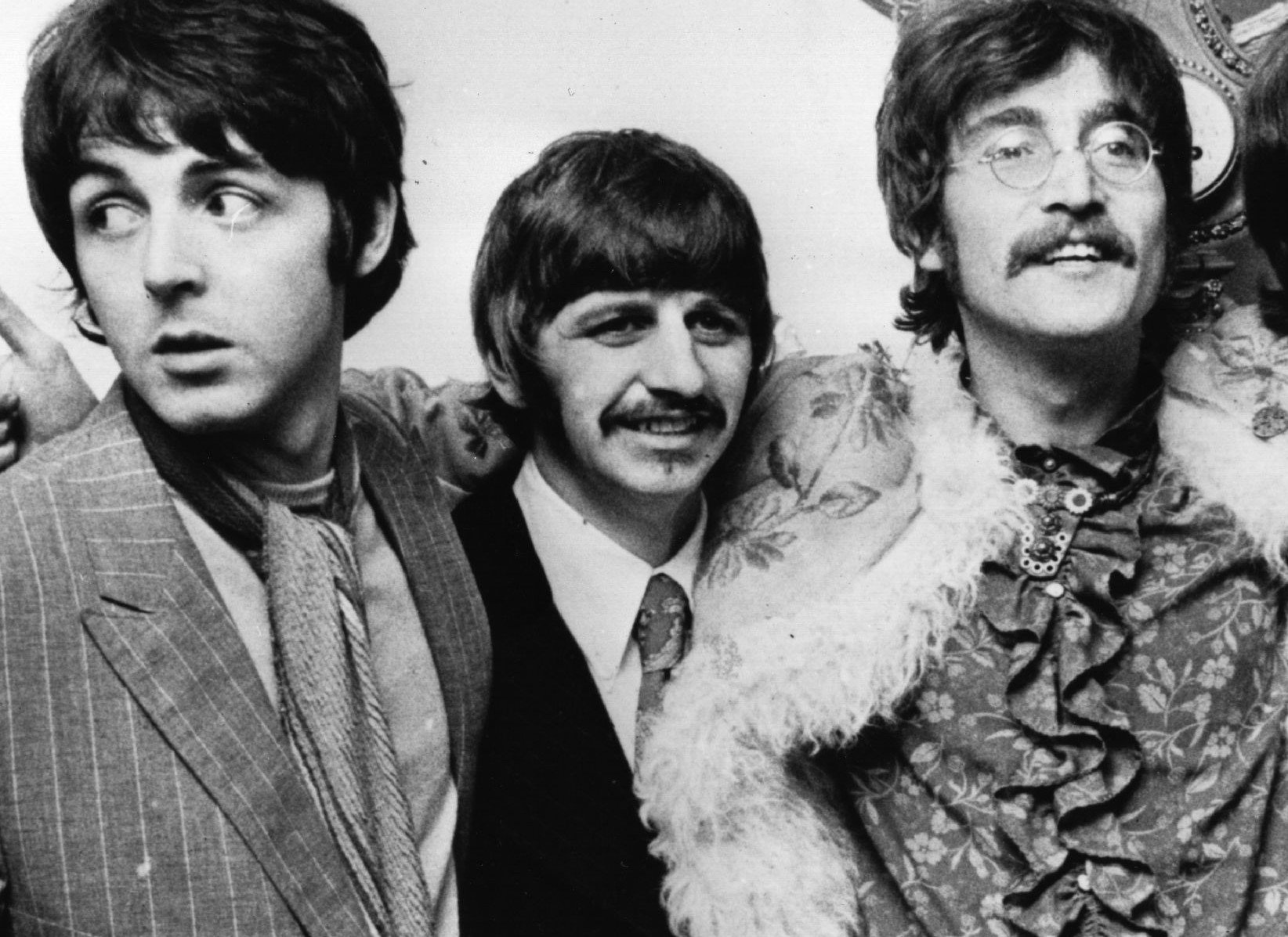 The Beatles' Paul McCartney, Ringo Starr, and John Lennon in black-and-white