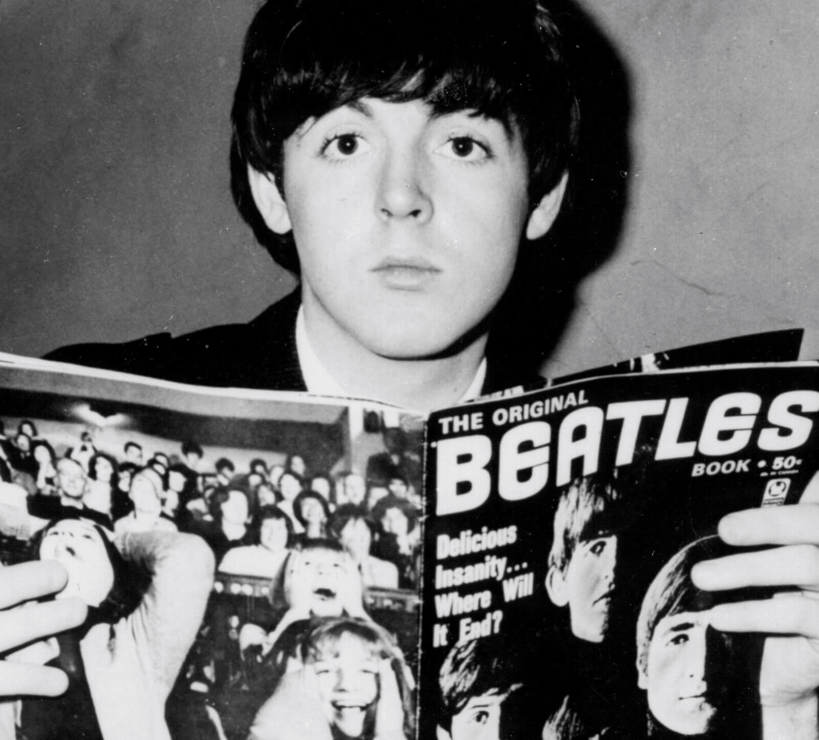 Paul McCartney with a Beatles magazine