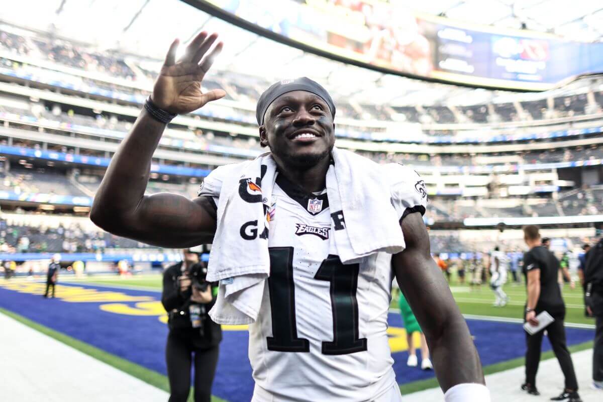 A.J. Brown, who has a couple of kids, waves to fans as he celebrates after defeating the Los Angeles Rams