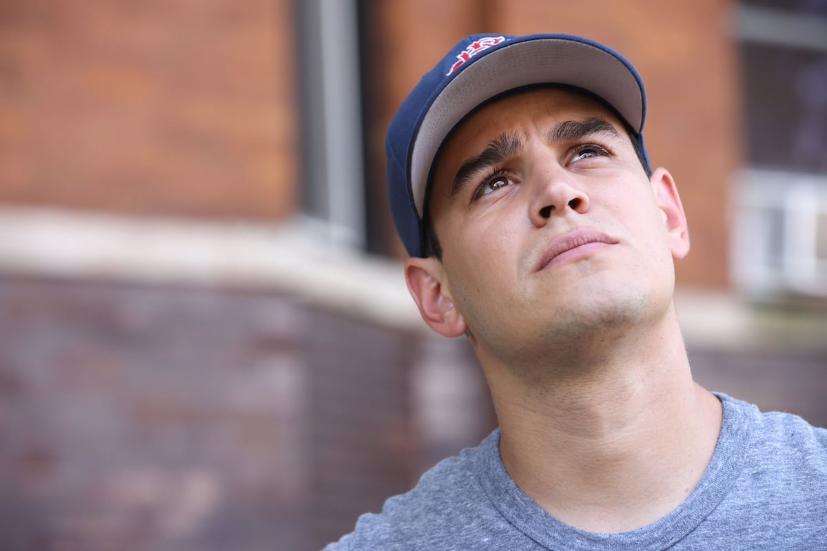 Alberto Rosende as Blake Gallo, wearing a baseball cap, in 'Chicago Fire'