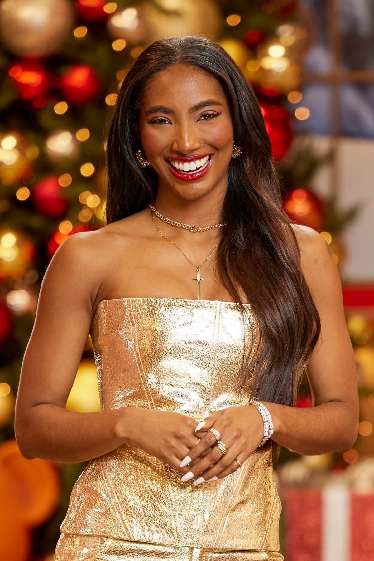 Taylor Hale of 'Big Brother Reindeer Games' posing in front of Christmas decorations