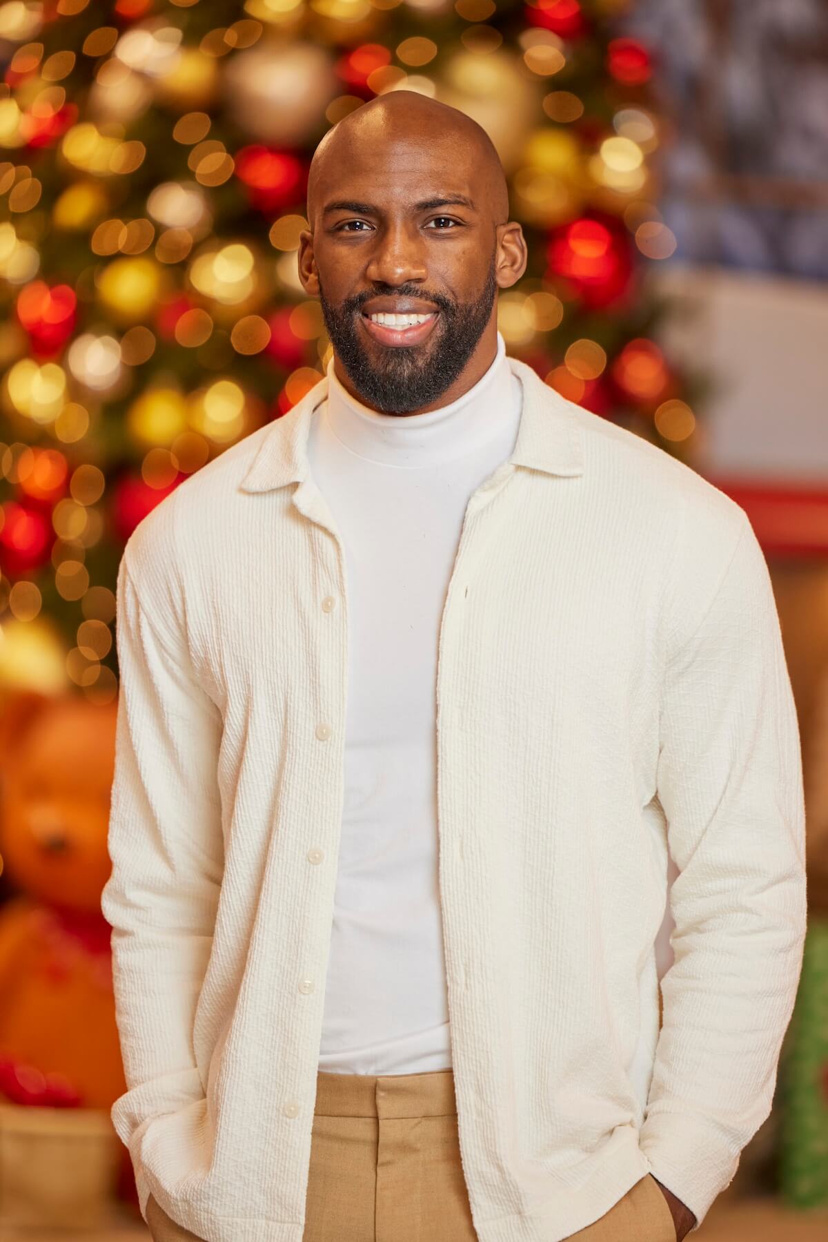 Xavier Prather of 'Big Brother Reindeer Games' posing in front of Christmas decorations