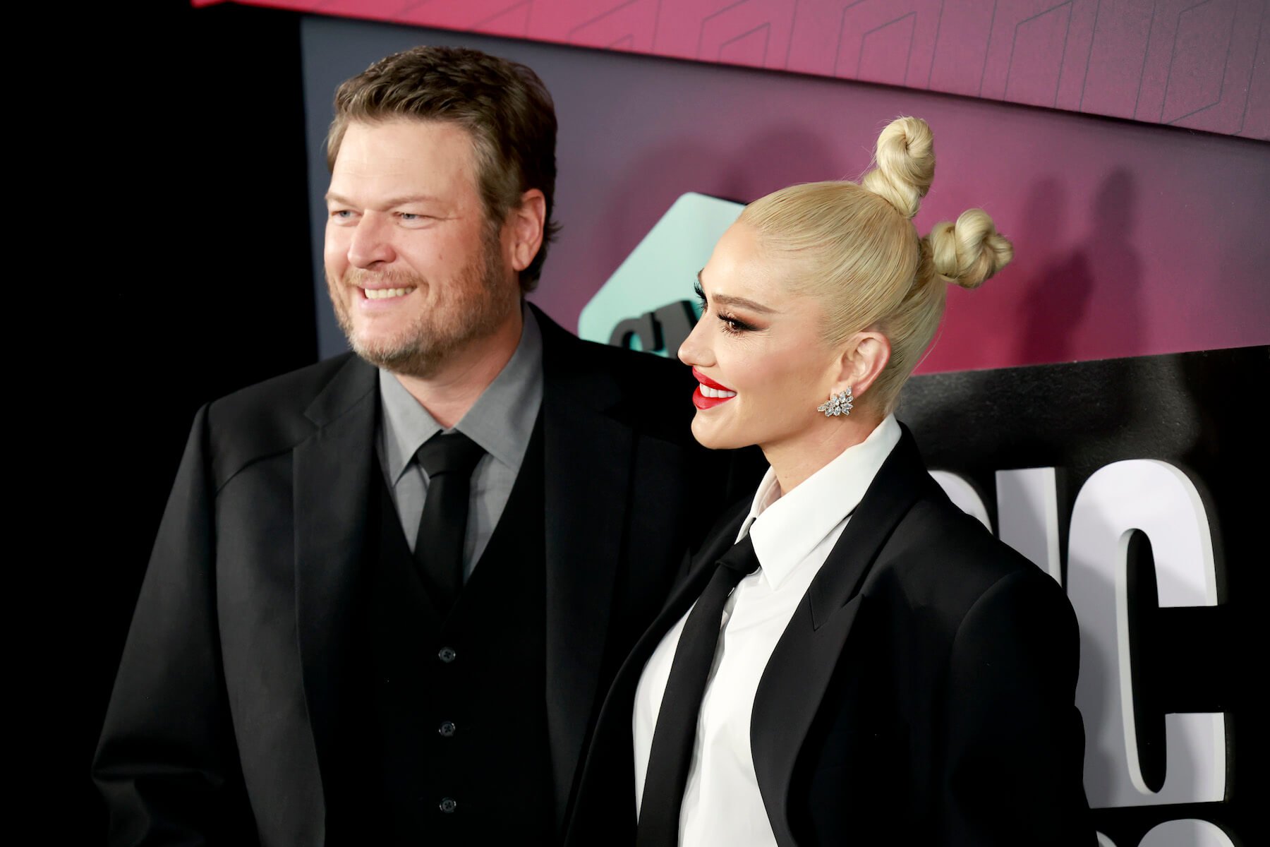 Blake Shelton and Gwen Stefani standing next to each other and smiling at the 2023 CMT Music Awards