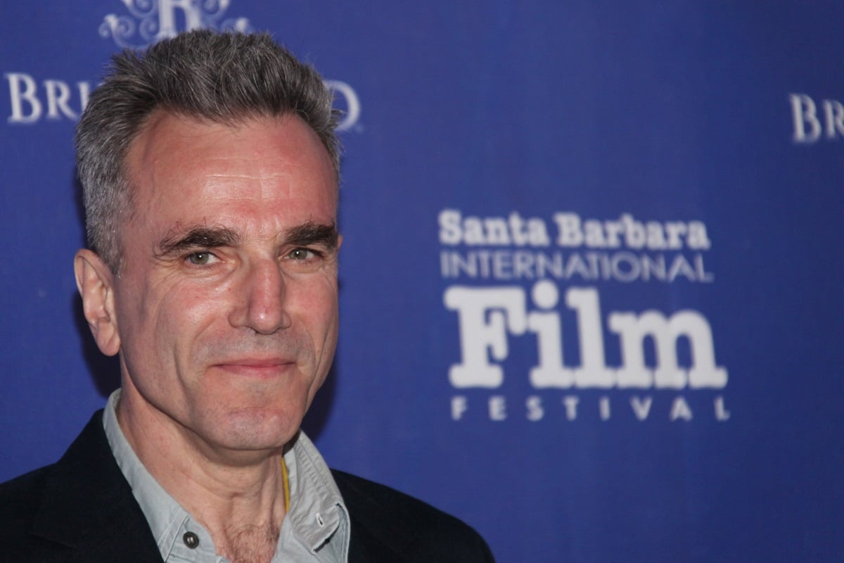 Daniel Day-Lewis posing while wearing a suit at the 28th Santa Barbara International Film Festival.