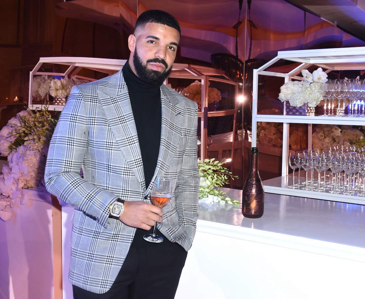 Rapper Drake holds at drink at The Mod Sèlection Champagne New Years Party