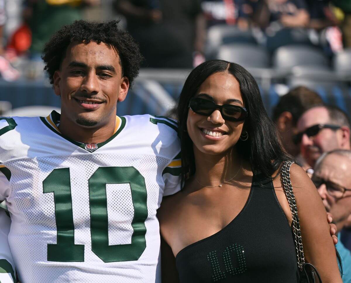 Green Bay Packers quarterback Jordan Love poses for a picture with his girlfriend Ronika Stone prior to the game against the Chicago Bears