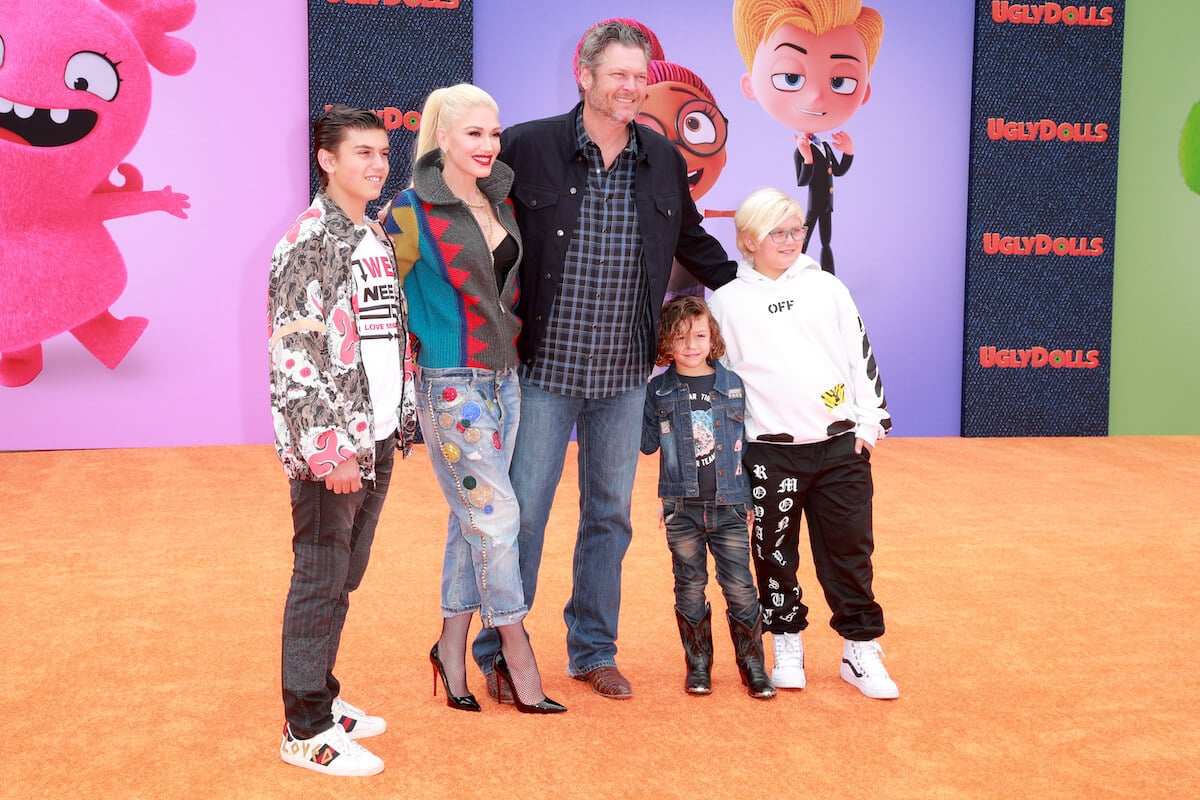 Gwen Stefani, Blake Shelton, and her three sons posing for a photo