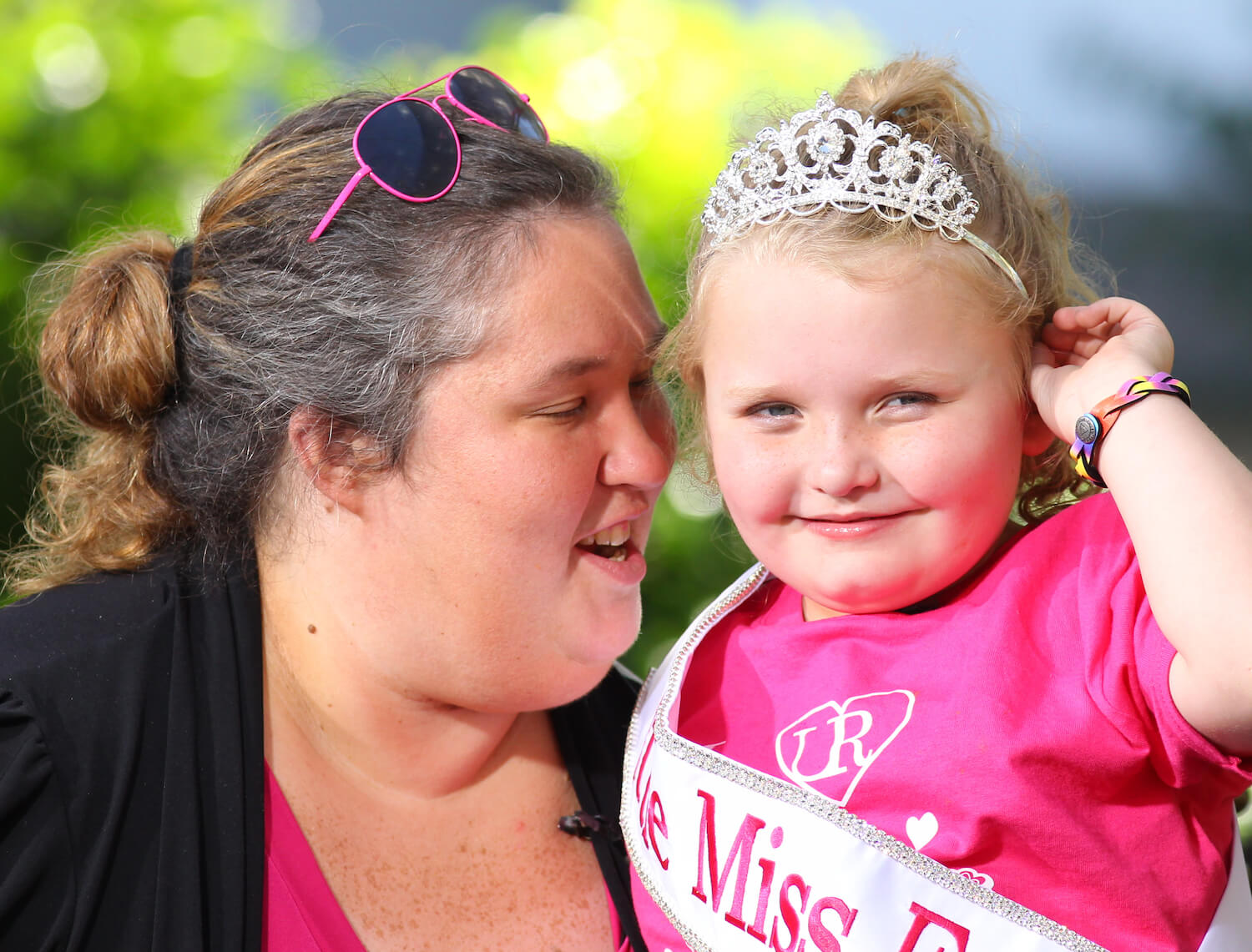 June Shannon holding Alana  'Honey Boo Boo' Thompson while Alana wears a tiara