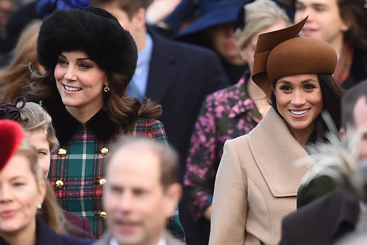Kate Middleton, who was told do 'less listening and learning' when Meghan Markle arrived, walks with Meghan Markle