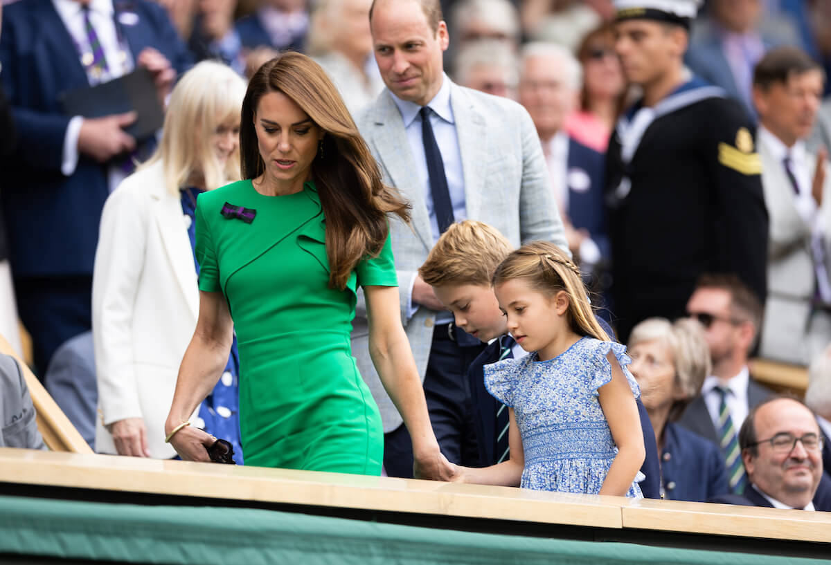Kate Middleton, whose decided on where Prince George will attend boarding school, walks with Prince George, Princess Charlotte, and Prince William