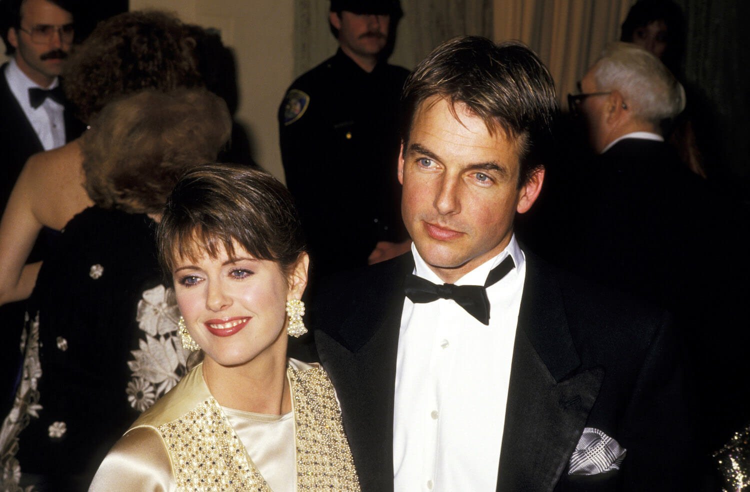 Pam Dawber and Mark Harmon dressed in fancy clothing at an event