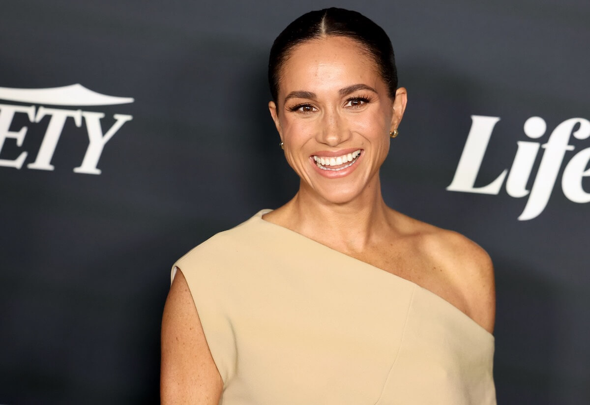 Meghan Markle, who appeared in Santa Barbara, California, after 'Endgame' debut, smiles wearing a beige dress.