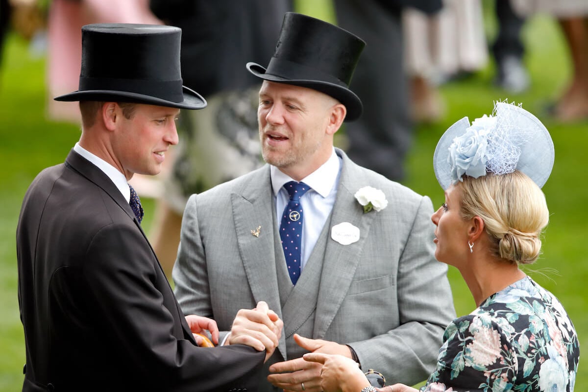 Mike Tindall, who revealed his nickname for Prince William on a podcast, stands with Prince William and Zara Tindall