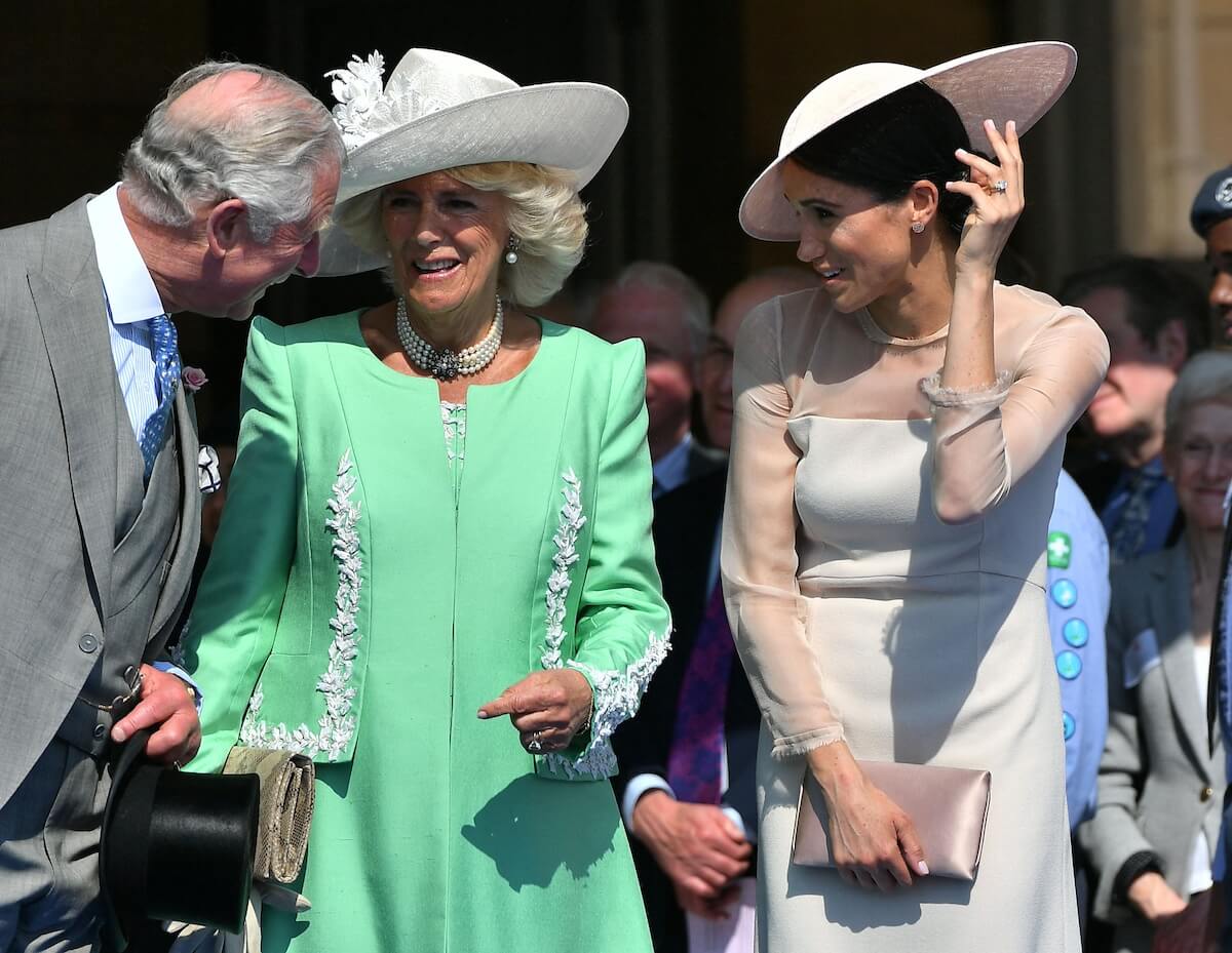 King Charles chats with Camilla Parker Bowles and Meghan Markle