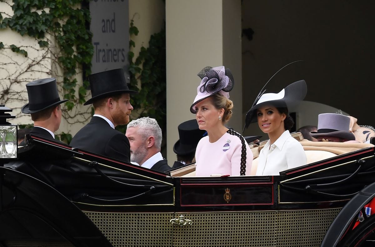 Prince Harry, Meghan Markle, and other members of the royal family arrive in a carriage to attend the first day of Royal Ascot