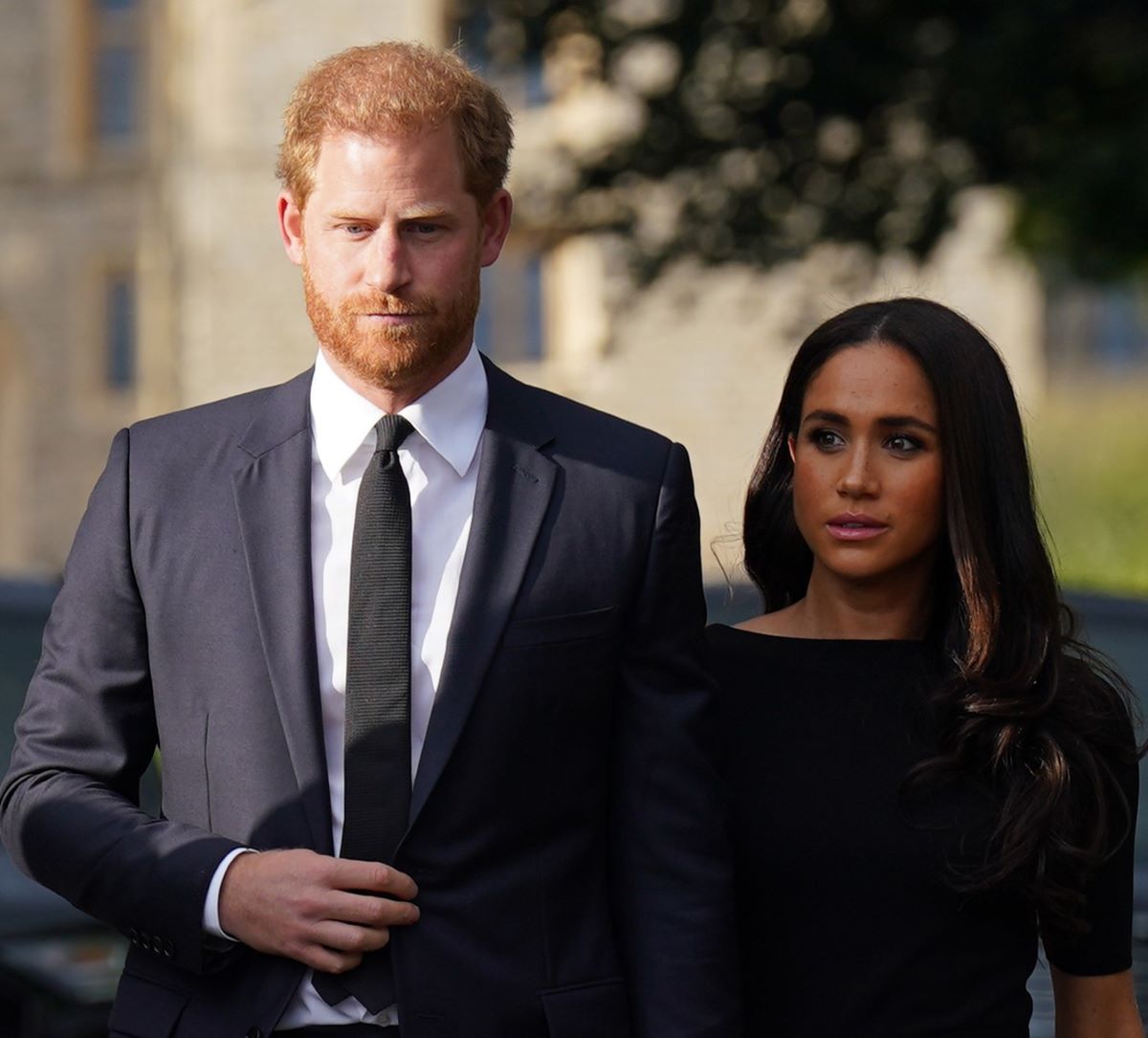 Prince Harry and Meghan Markle walk together to meet members of the public at Windsor Castle after Queen Elizabeth II's death