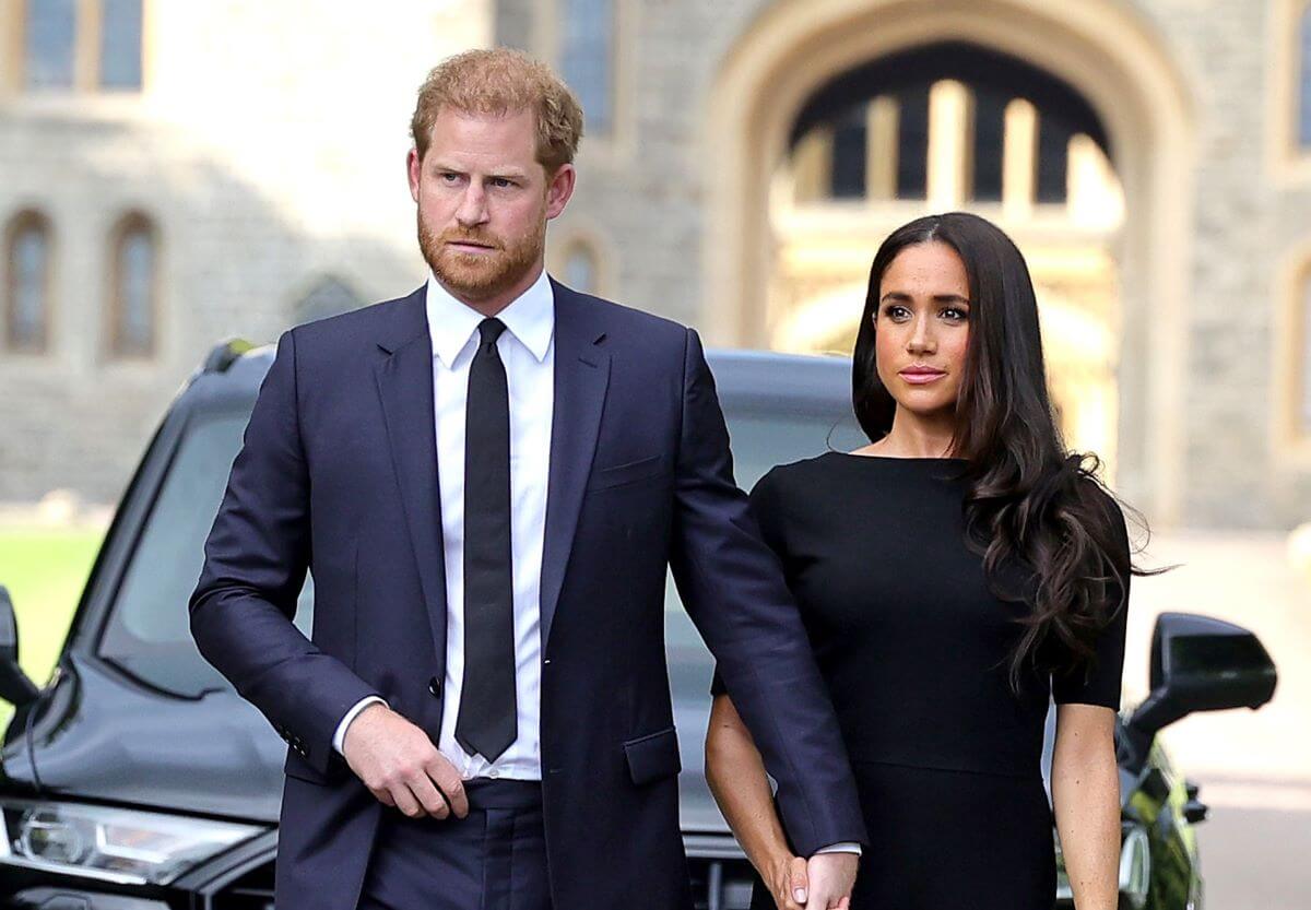 Prince Harry and Meghan Markle, who reportedly blame the royal family for their failures, on the Long Walk at Windsor Castle arrive to view tributes to Queen Elizabeth II