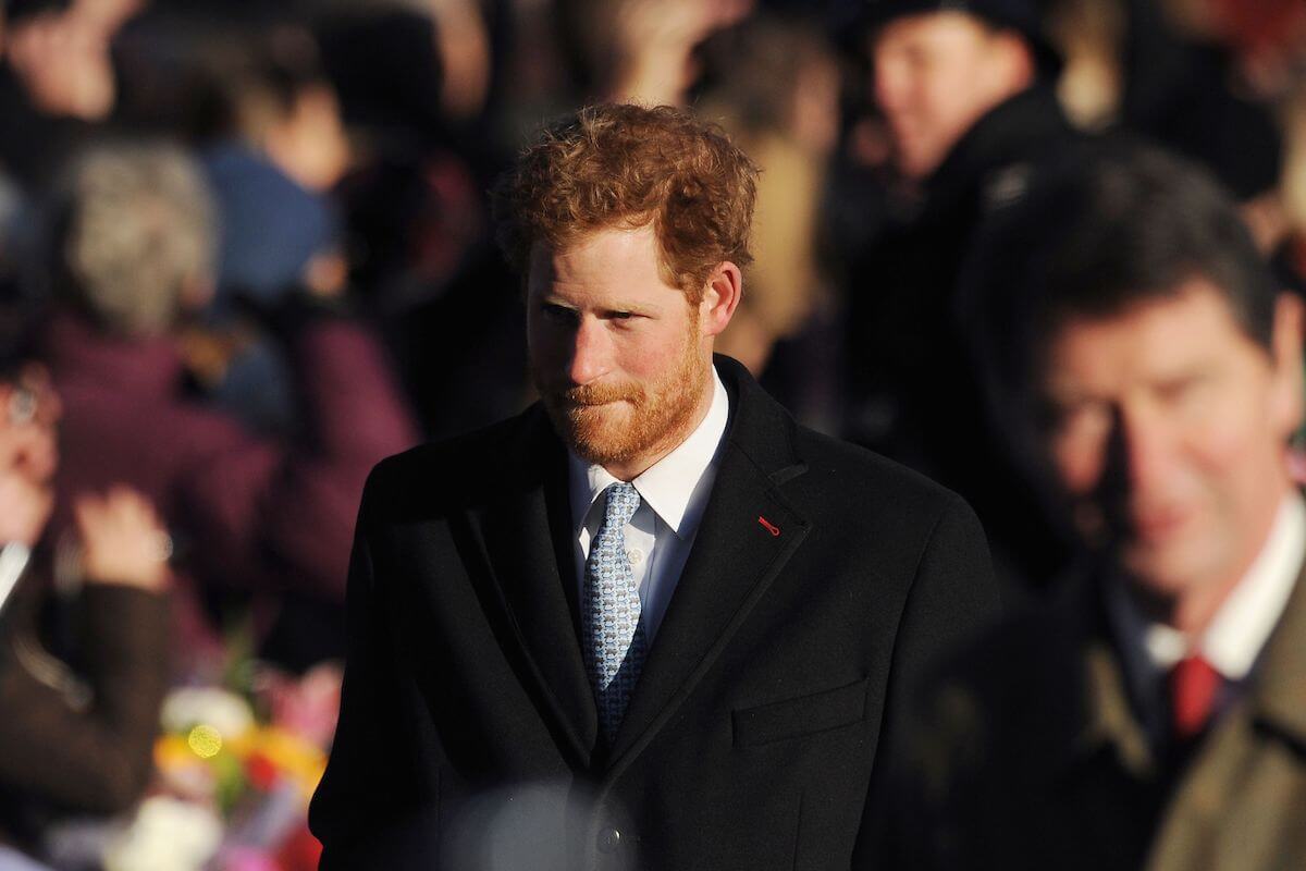 Prince Harry, who said he felt 'unappreciated' and 'unloved' at Christmas in 2013, walks to church on Christmas Day, 2013.